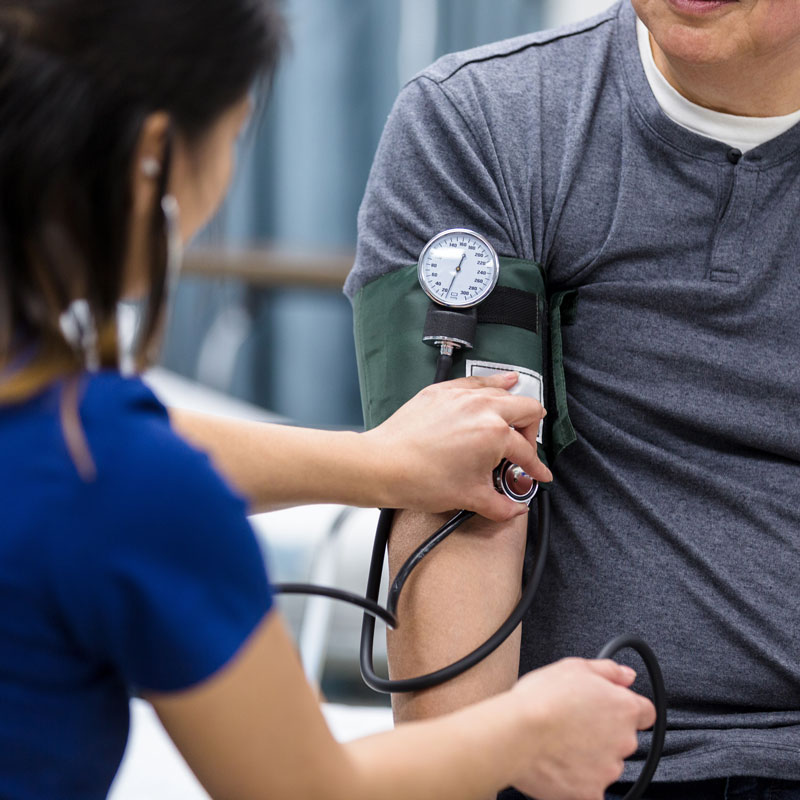 nurse taking patients blood pressure