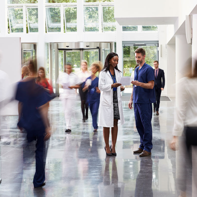 medical facility interior with two physicians talking